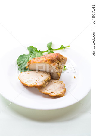 baked chicken fillet pieces with spices and herbs, in a ceramic form baked chicken fillet pieces with spices and herbs, in a ceramic form 104807141