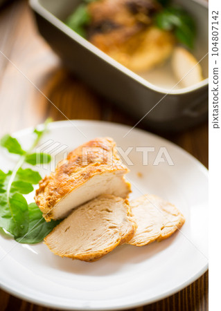 baked chicken fillet pieces with spices and herbs, in a ceramic form baked chicken fillet pieces with spices and herbs, in a ceramic form 104807142