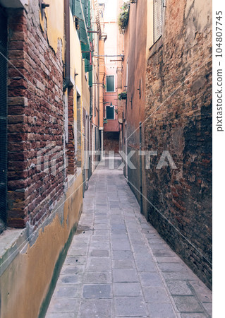 View of a narrow street in Venice View of a narrow street in Venice 104807745