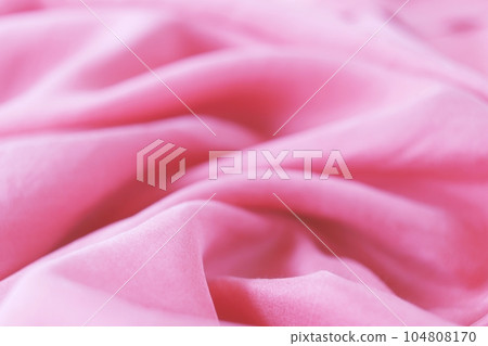 Pink silk, satin fabric texture, draped with folds, top view, pastel shade, concept romantic background 104808170