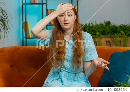 Upset young woman making face palm gesture, feeling bored, disappointed in fail bad results news 104808664