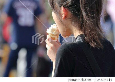 Soft serve ice cream Woman licking soft serve ice cream Soft serve ice cream Woman licking soft serve ice cream 104808715
