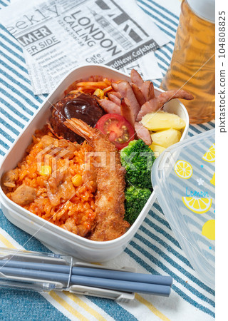 A delicious bento box for children, chicken rice, fried shrimp, hamburger, vertical position 104808825