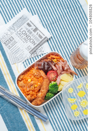 A delicious bento box for children, chicken rice, fried shrimp, hamburger, vertical position A delicious bento box for children, chicken rice, fried shrimp, hamburger, vertical position 104808826