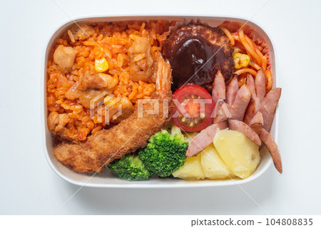 A delicious bento box for children, chicken rice, fried shrimp, hamburger steak, white background A delicious bento box for children, chicken rice, fried shrimp, hamburger steak, white background 104808835