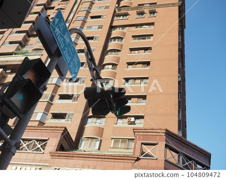 Landscape of Kaohsiung City, Taiwan, traffic lights and high-rise apartments, blue sky spreads on the right side, composition from below, Landscape of Kaohsiung City, Taiwan, traffic lights and high-rise apartments, blue sky spreads on the right side, composition from below, 104809472