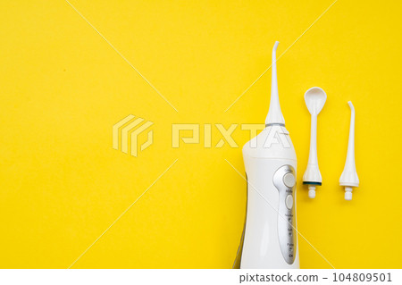Mouth aerator on a yellow background with different nozzles. View from above 104809501