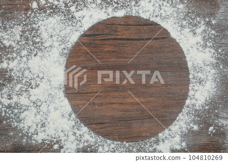 Frame made with flour on wooden table, top view. Space for text Frame made with flour on wooden table, top view. Space for text 104810269