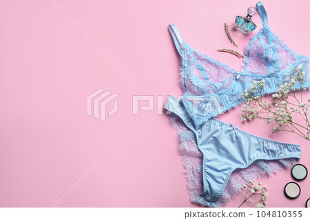 Flat lay composition with women's underwear and space for text on pink background 104810355