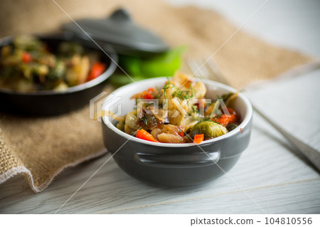fried brussels sprouts with cauliflower and other vegetables in a bowl fried brussels sprouts with cauliflower and other vegetables in a bowl 104810556