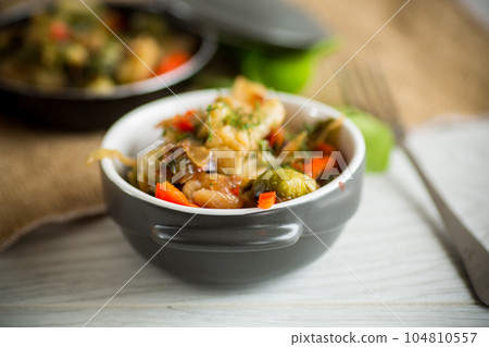 fried brussels sprouts with cauliflower and other vegetables in a bowl fried brussels sprouts with cauliflower and other vegetables in a bowl 104810557