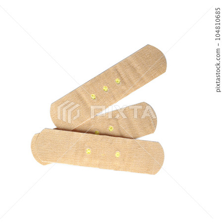 Medical sticking plasters isolated on white. First aid item Medical sticking plasters isolated on white. First aid item 104810685
