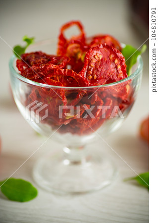 a handful of dried tomatoes and fresh tomatoes a handful of dried tomatoes and fresh tomatoes 104810791