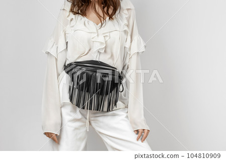 Woman with Black Leather Crossbody Fanny Pack Bag 104810909