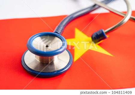 Stethoscope on Vietnam flag background, Business and finance concept. Stethoscope on Vietnam flag background, Business and finance concept. 104811409