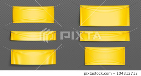 Blank yellow canvas banners hanging on ropes 104812712
