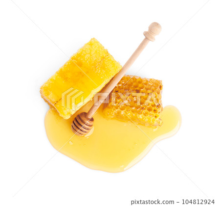 Fresh honeycombs and dipper isolated on white, top view Fresh honeycombs and dipper isolated on white, top view 104812924