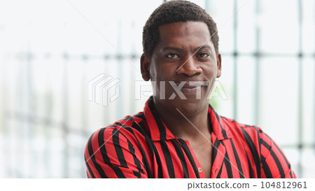 Closeup headshot of a young thoughtful african american businessman entrepreneur looking straight ahead. Closeup headshot of a young thoughtful african american businessman entrepreneur looking straight ahead. 104812961