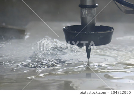 Close-up scene of multi-axis abrasive waterjet cutting machine cutting the aluminum plate. 104812990