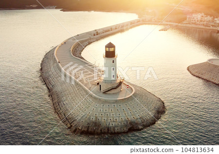Amazing aerial view of lighthouse and dam on Lustica bay near Tivat, Montenegro on sunny day. 104813634
