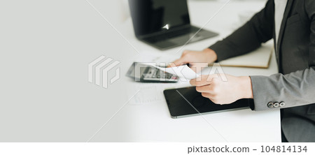Young asian male work with financial papers at home count on calculator before paying taxes receipts online, planning budget glad to find chance for economy saving money, audit concepts 104814134