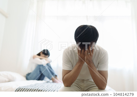Young couple lying in bed in bedroom at home, woman in lingerie sleeping, sad, frustrated man thinking about relationships, family having sexual problems, erectile dysfunction concepts 104814279