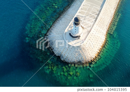 Amazing aerial view of lighthouse and dam on Lustica bay near Tivat, Montenegro on sunny day. 104815395