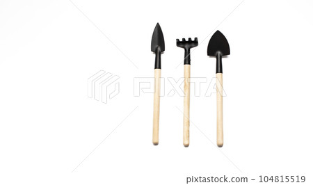 Wooden Gardening tools, shovel, rake on white background Wooden Gardening tools, shovel, rake on white background 104815519