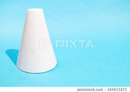 single hand-crafted paper frustum cone on blue single hand-crafted paper frustum cone on blue 104815872