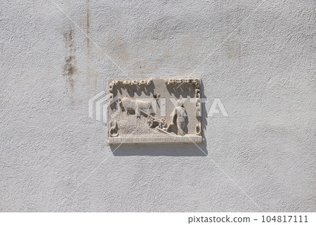 A bas-relief depicting a farmer with a plow A bas-relief depicting a farmer with a plow 104817111