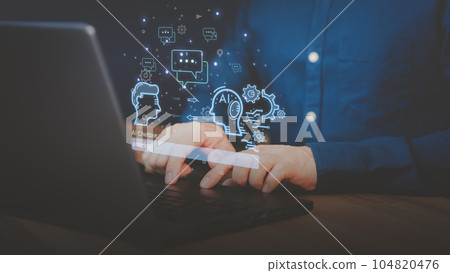 Adult man using a laptop computer chatting with chat bot, Chat with smart AI or Artificial Intelligence technology. Futuristic technology transformation. Chatbot ai communication. 104820476