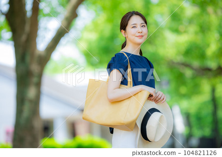 A woman walking outdoors 104821126
