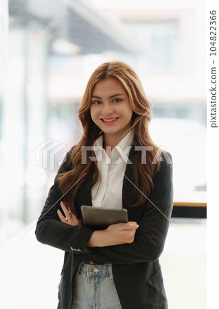 Portrait of young happy woman and confident business at office Portrait of young happy woman and confident business at office 104822366
