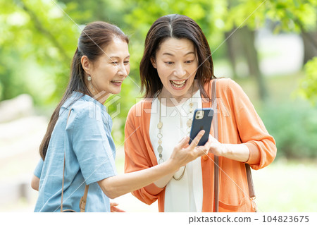 A woman to take with a smartphone A woman to take with a smartphone 104823675