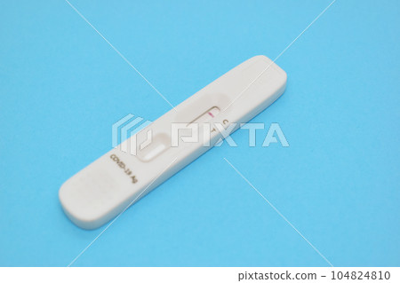 covid test kid on blue background covid test kid on blue background 104824810