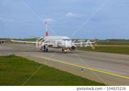 Plane on runway is preparing for take off departure 104825226