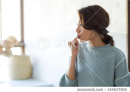 Photo of a woman tasting Photo of a woman tasting 104825908