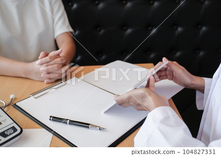 Professional medical doctor in white uniform gown coat interview consulting patient Professional medical doctor in white uniform gown coat interview consulting patient 104827331