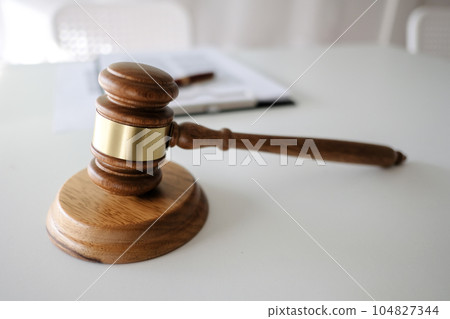 Judge gavel hammer on Lawyer desk. 104827344