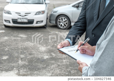 Loss Adjuster Insurance Agent Inspecting Damaged Car. .Sales manager giving advice application form document considering mortgage loan offer for car  insurance 104827346