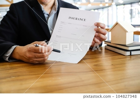 Business people signing contract making deal with real estate agent Concept for consultant home insurance.Real estate investment Property insurance security. Real estate agent 104827348