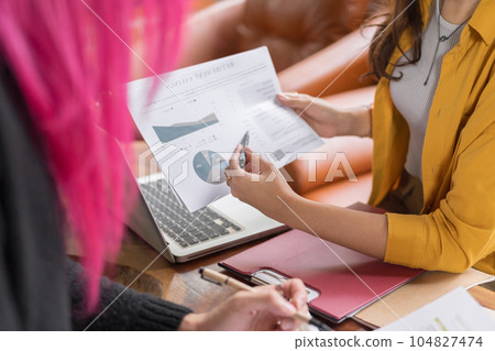 LGBTQ+ transgender man Beautiful Authentic Specialist with Pink Hair and Non-binary trans working together Working Design in creative workplace team work colleagues Gender equality 104827474