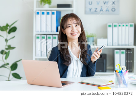 Young woman working in the office 104828372