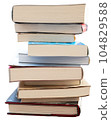 Stacked book clippings 104829588