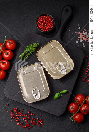 Tin or aluminum rectangular can of canned food with a key 104830465