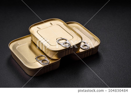 Tin or aluminum rectangular can of canned food with a key 104830484