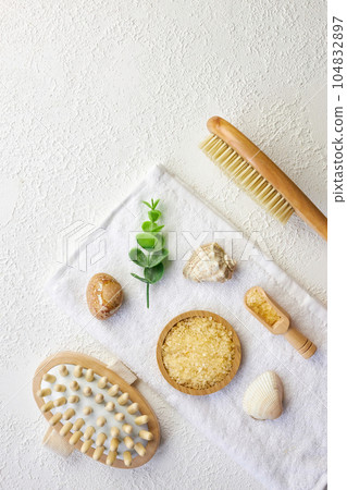 Cosmetic, massage and bath accessories set on white texture background 104832897