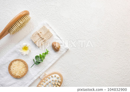 Cosmetic, massage and bath accessories set on white texture background Cosmetic, massage and bath accessories set on white texture background 104832900
