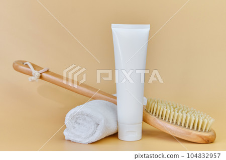 Massage brush with natural bristles on a terry towel. Massage brush with natural bristles on a terry towel. 104832957