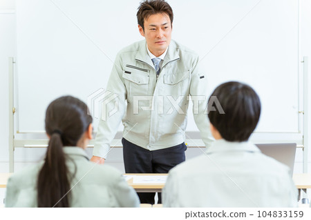 Male president, engineer, engineer, manager explaining at a meeting, seminar, study session in a factory, company, office, conference room Male president, engineer, engineer, manager explaining at a meeting, seminar, study session in a factory, company, office, conference room 104833159